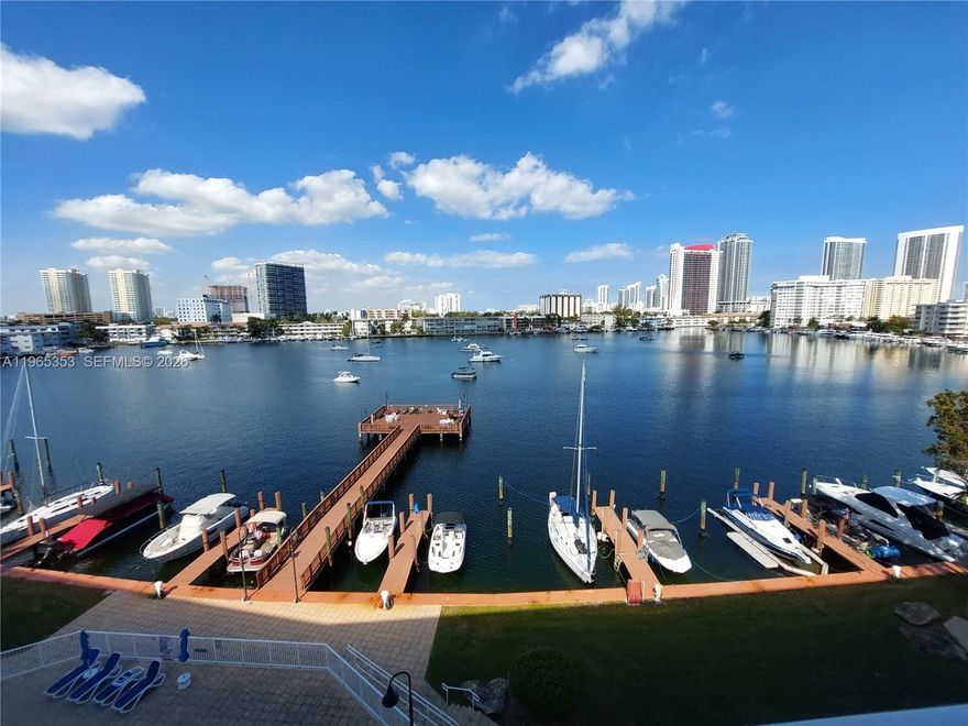 Wake up to shimmering water views and end your day with golden sunsets from your oversized private balcony in this beautifully renovated, turn-key, fully furnished 2-bedroom, 2-bath waterfront retreat. Available for stays from 30 days up to 6 months, this bright and airy residence blends comfort and coastal charm with a spacious open layout, modern finishes, tile floors, and stylish décor designed for effortless living. The primary suite opens directly to the balcony, inviting peaceful mornings with coffee and bay breezes. Enjoy resort-style amenities including a heated waterfront pool, BBQ area, and a sun-soaked dock perfect for relaxing by the water. Laundry is conveniently located on the same floor, plus one covered parking space is included. Ideally positioned on Golden Isles Drive in a charming boutique building, you’re just a short stroll to the beach, Publix, Walmart, shops, restaurants, and banks. Seasonal pricing varies based on availability—reach out to reserve your waterfront escape.