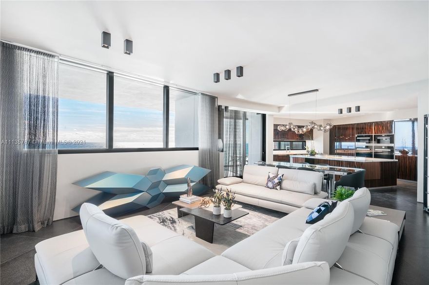 One of a kind apartment at the exclusive Porsche Design Tower, impeccably finished by Hernan Arriega and fully furnished by Roche Bobois. This spacious 3 bedroom features stunning views of the ocean, a jacuzzi on the balcony, and a 2 car garage in the living room. All the lighting inside this mansion in the sky is by Porsche Design, and the closets are by the most high end closet company in Miami, Ornare. The only building in the world that allows you to drive your car directly into your living room. Full service building complete with concierge, 24 hour valet and security, car concierge, pool, spa, oceanfront gym, yoga studio, movie theatre, party room, bar, restaurant with room service, sunset deck, viccci shower, virtual sports room, car racing simulator & the groundbreaking Dezervator.