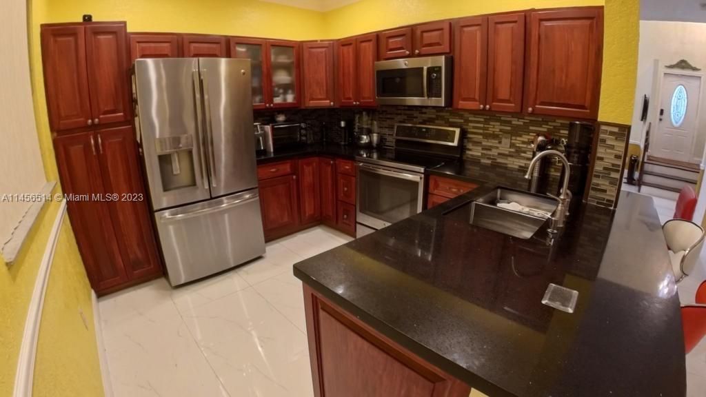 Photo of 380 NW 102nd Ter, Pembroke Pines, FL 33026 (MLS # A11456514)