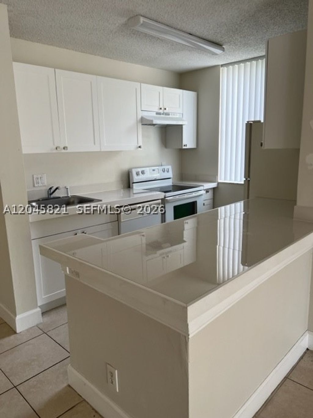 Photo of 10717 Cleary Blvd #111, Plantation, FL 33324 (MLS # A12045821)