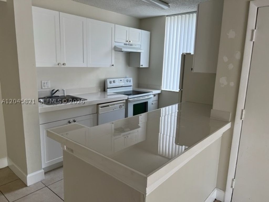 Photo of 10717 Cleary Blvd #111, Plantation, FL 33324 (MLS # A12045821)