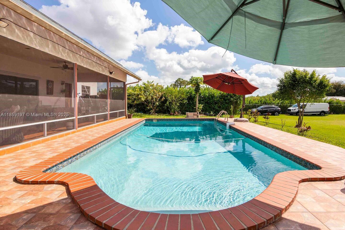 Escape to your own private farm-style retreat in the heart of Homestead! This spacious property offers the perfect blend of peaceful country living and resort-style comfort. Surrounded by lush greenery and open space, it’s ideal for those seeking privacy, nature, and endless possibilities—whether for a family estate, agricultural use, or future development. Enjoy the quiet, yet remain just minutes from shopping, dining, and major highways.
It has a Tiki Bar and a lot of fruits plants.