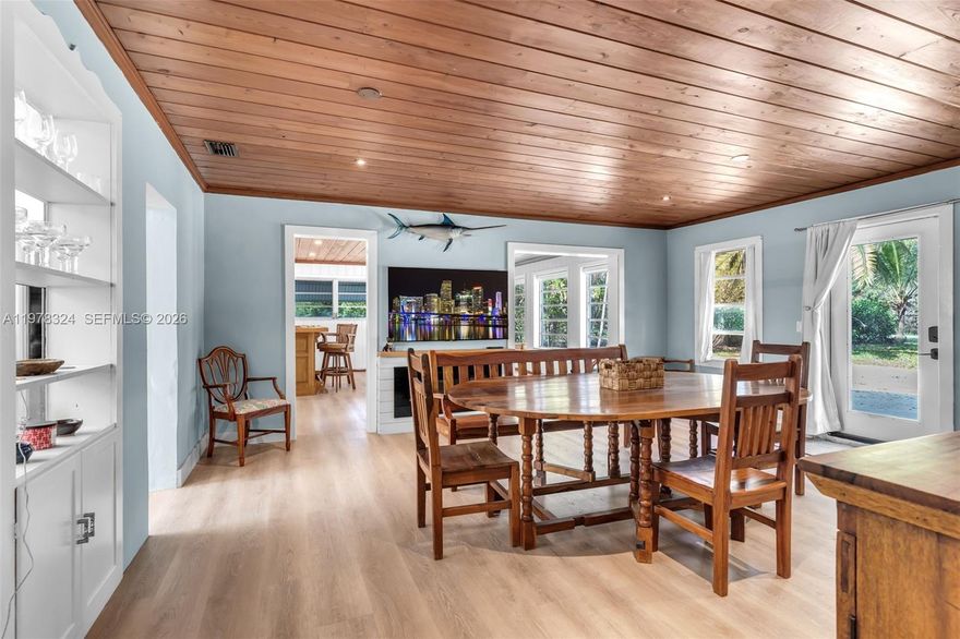 Captivating 3BD/2BA ranch-style home situated on nearly 2 acres, featuring a separate 2BD/2BA in-laws’ cottage—perfect  potential rental income. The main home has been remodeled and includes a new roof and A/C unit. Interior features include a Florida room with bar area, formal dining room, and family room, providing comfortable and functional living spaces. Unique construction details include a Dade County pine roof and a concrete ceiling in the master bedroom.

The in-laws’ cottage offers its own charm with a partial wrap-around patio and wood roof, creating a relaxing outdoor setting.

Outdoor amenities include a covered pergola over an outdoor BBQ/bar area and fire pit, ideal for entertaining. The property also features a well-maintained chicken coop and a post-frame barn, centrally located on the land. Plenty of space for gardening, hobby farming, or enjoying peaceful country living while still being conveniently located near local amenities.