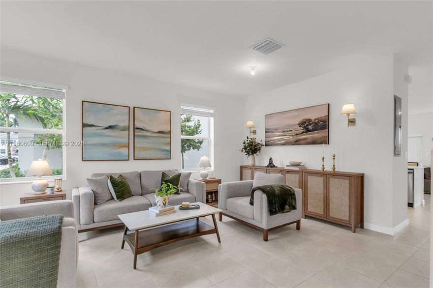 4.5% ASSUMABLE INTEREST RATE! This is a must-see home with a low rate that could save you hundreds monthly! This stunning corner unit offers ultimate privacy with NO BACK NEIGHBOR! Enjoy modern villa living with beautifully designed space. The open concept layout is perfect for entertaining, featuring natural light, high ceilings, and a kitchen with serene views to your private backyard. This is the best layout for your money! The split floor plan upstairs provides maximum privacy for the primary suite. Move-in ready and in pristine condition throughout. The play area steps away from your backyard. Near Homestead Air Reserve Base, shopping centers and easy access to US1.