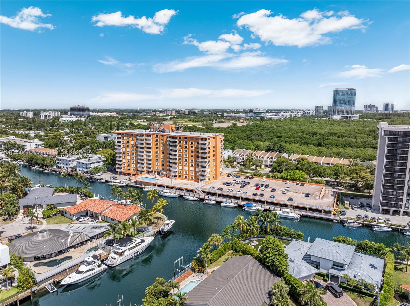 A hidden gem waiting to be discovered! Step into this totally surprising and bright unit perched on the top-floor, SE corner of well maintained Waterside Towers. Enjoy breathtaking views of canals, Inter-coastal, lush parklands, and city skyline from inside the unit and the balcony. It is thoughtfully outfitted with everything you could need for peaceful, turnkey living, including bicycles for local exploration and a stylishly appointed interior making it easy to feel at home from day one. The Building is nestled east of Biscayne BLVD, down the street from Arch Creek Park Nature Preserve with walking, biking, kayaking, and dog-walking trails. Miami-Dade College Biscayne Campus and many shops and restaurants are also nearby. Laundry facilities are conveniently located on every floor.