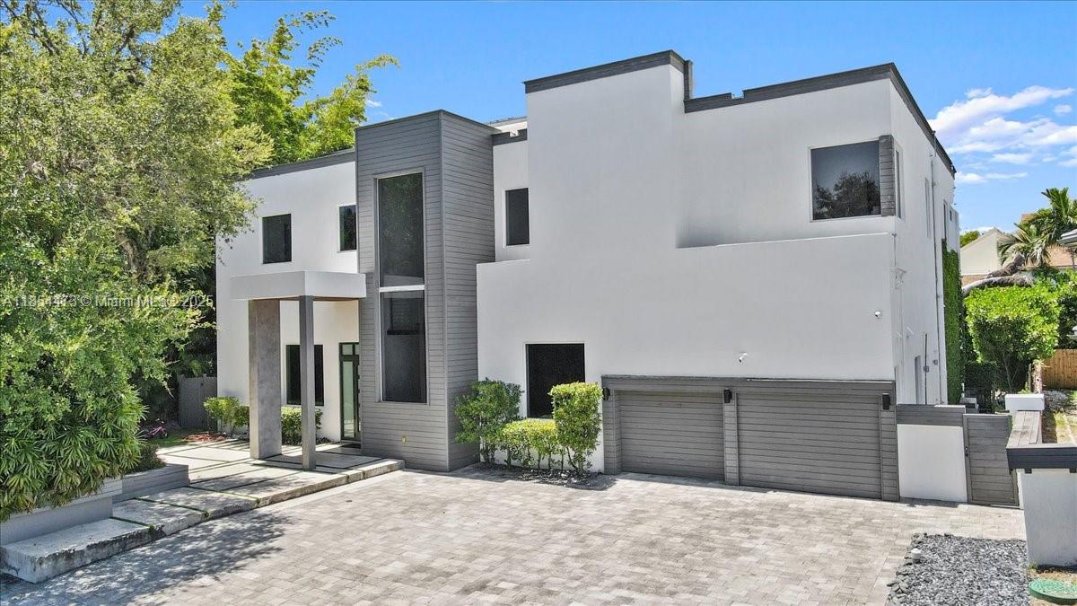 This stunning 5BD/5.5BA estate is nestled in a prestigious gated community, just minutes from the beach and Aventura Mall. This beautifully designed home offers the perfect blend of elegance, comfort, and functionality. This spacious home features high ceilings, a gourmet kitchen with marble countertops, Sub-Zero appliances, gas stove, and modern/contemporary cabinetry. Each bedroom includes an bath, providing comfort and privacy for every member of the household. The primary suite boasts a private balcony that overlooks your backyard. Enjoy multiple living spaces, a maid’s quarters, family room, laundry room and a rain soft water filtration system throughout the entire home. Outdoor offers a heated saltwater pool and lush landscaping.