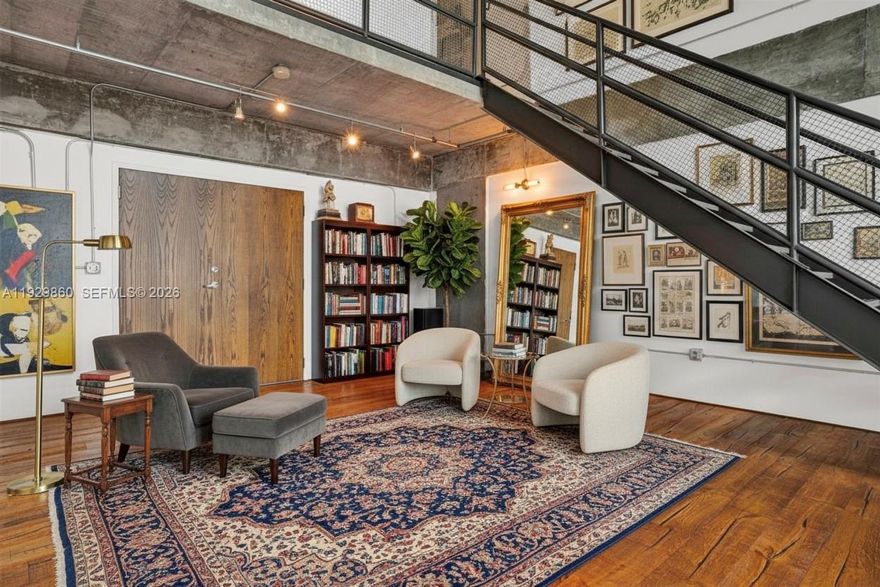 Designed for those who appreciate Art and architectural character, contemporary luxury, and a truly elevated lifestyle.

Experience the essence of upscale urban living in this exceptional 2-story New York–style industrial loft, featuring soaring 20-foot ceilings, expansive volumes, and an abundance of natural light that floods the space throughout the day. Rich wood flooring stretches across the entire residence, leading to an elegant open mezzanine Huge bedroom that overlooks the grand living area below.

The spacious, bright living room flows seamlessly toward a private balcony, offering captivating views of the city—perfect for relaxing or entertaining in a stylish metropolitan setting.

Parc Lofts is ideally situated on 17th Street, positioned at the nexus of Miami’s most dynamic neighborhoods: just north of Downtown and moments from Wynwood, the Design District, and Midtown. This exclusive building offers a curated selection of premium amenities, including 24-hour concierge and security, a fully equipped fitness center, a heated pool and hot tub, and a lushly landscaped sun deck with serene outdoor lounges surrounding a beautiful koi pond.
