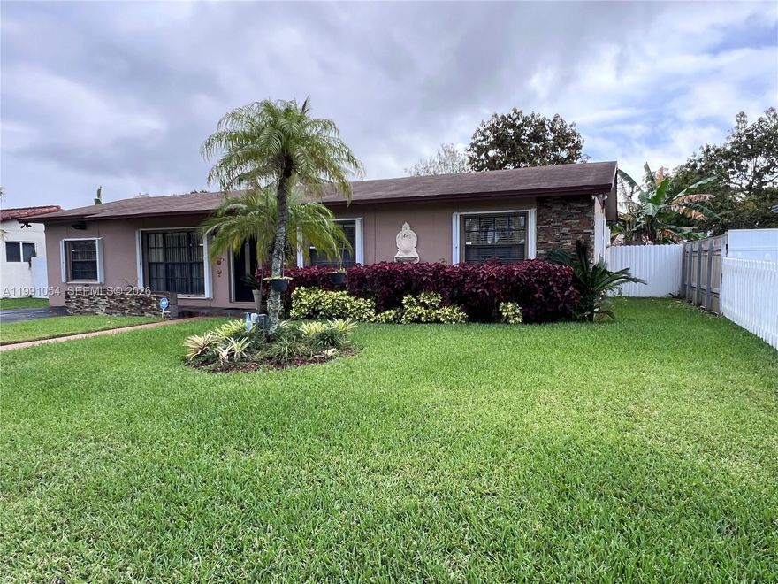 Welcome to this charming 3-bedroom, 2-bath home nestled in a quiet Miami neighborhood! This well-maintained property features beautiful wood flooring throughout and a thoughtfully converted garage that serves as an additional bedroom with its own private entrance, perfect for guests, a home office, or easily transformed into in-law quarters. This room also has its own a/c unit separate from the main house. 

The kitchen is equipped with stainless steel appliances, sleek granite countertops, and plenty of space for cooking and entertaining. Step outside to a covered patio ideal for relaxing or hosting gatherings, all overlooking a spacious, fully fenced yard that offers privacy and room to enjoy.

The backyard also includes a large shed for extra storage, while the lush, well-manicured lawn is kept vibrant year-round with an automatic sprinkler system. Accordion shutters provide added convenience and peace of mind.

This move-in-ready home has everything you need, comfort, flexibility, and outdoor space, ready for a new family to make it their own!