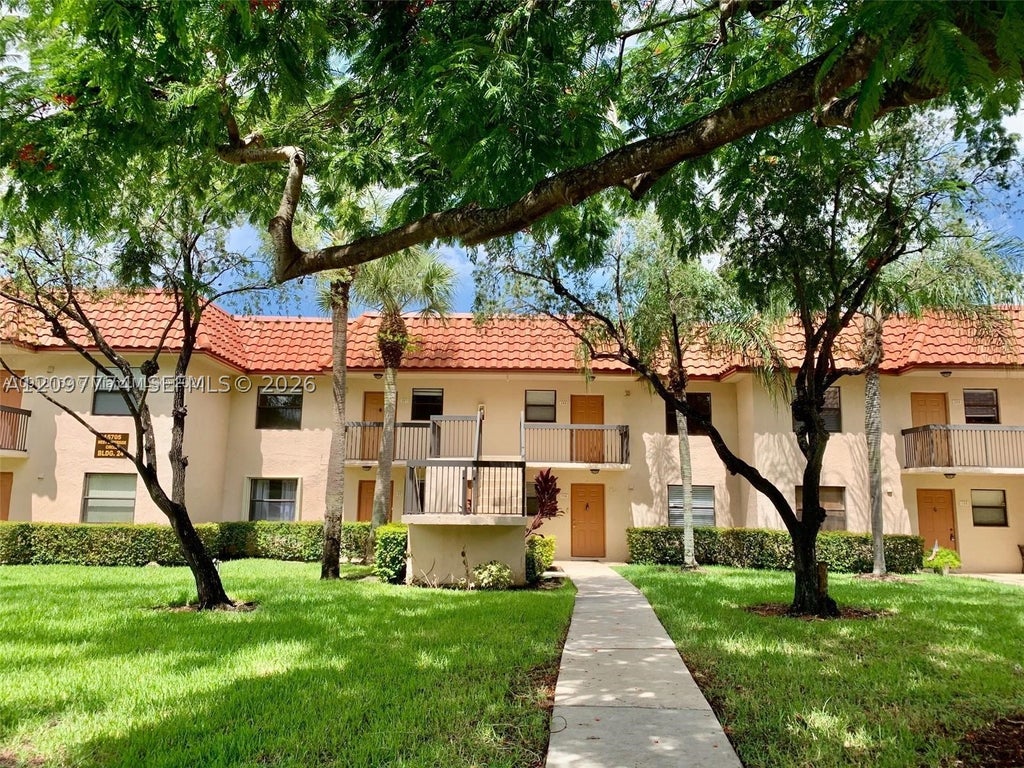 Photo of 15705 W Waterside Cir #203, Sunrise, FL 33326 (MLS # A12097774)