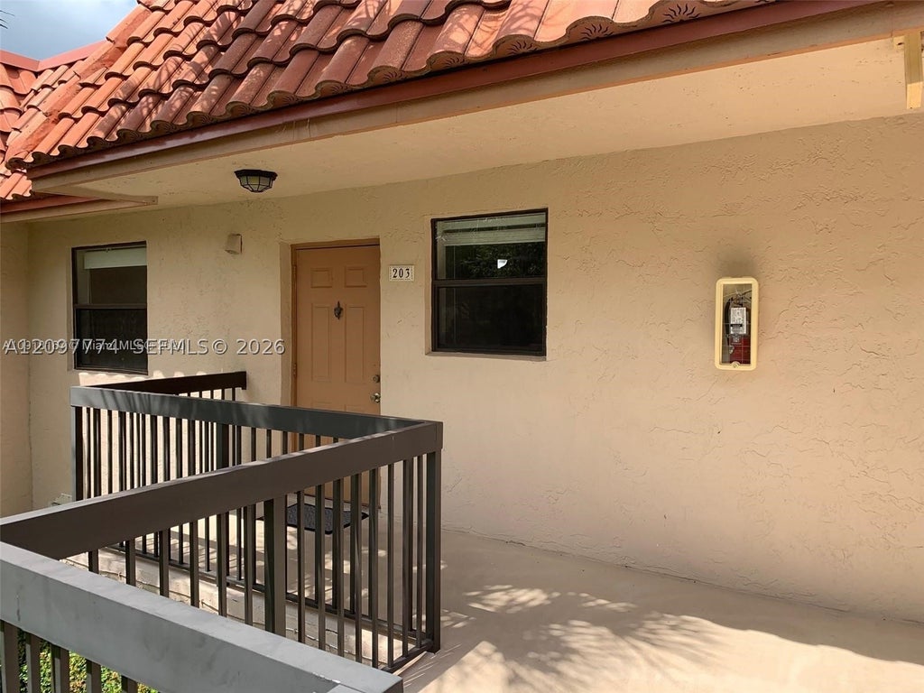 Photo of 15705 W Waterside Cir #203, Sunrise, FL 33326 (MLS # A12097774)