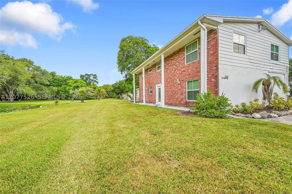 Photo of 1201 Old Hiatus Rd, Plantation, FL 33323 (MLS # A12077526)