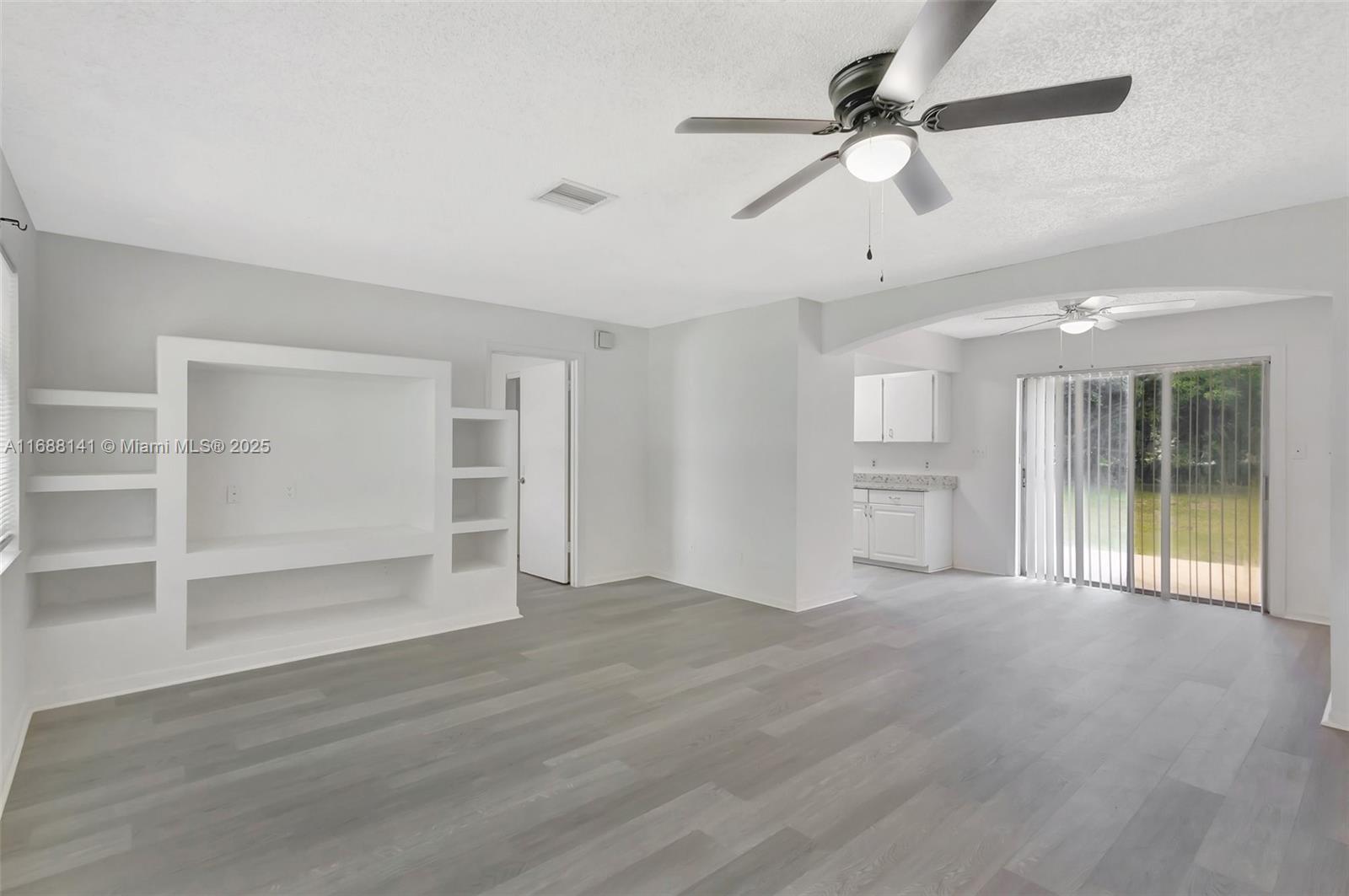 Welcome to this updated 3-bedroom, 2-bathroom home, situated on a generously sized corner lot. Enjoy the fresh appeal of newly installed vinyl flooring and granite kitchen countertops. The spacious layout provides ample room for relaxation and entertaining. Outdoors, you'll find a variety of trees, including a mango tree, perfect for those who enjoy gardening. Ideally located in a desirable neighborhood that offers convenient access to major freeways (I-95 & Turnpike), shopping centers, and a diverse selection of local eateries, making daily commutes and errands a breeze. With a new roof installed on 10/2024 with a 10-year transferable warranty on workmanship and an air conditioning unit installed on 10/2024, this property ensures comfortable living.