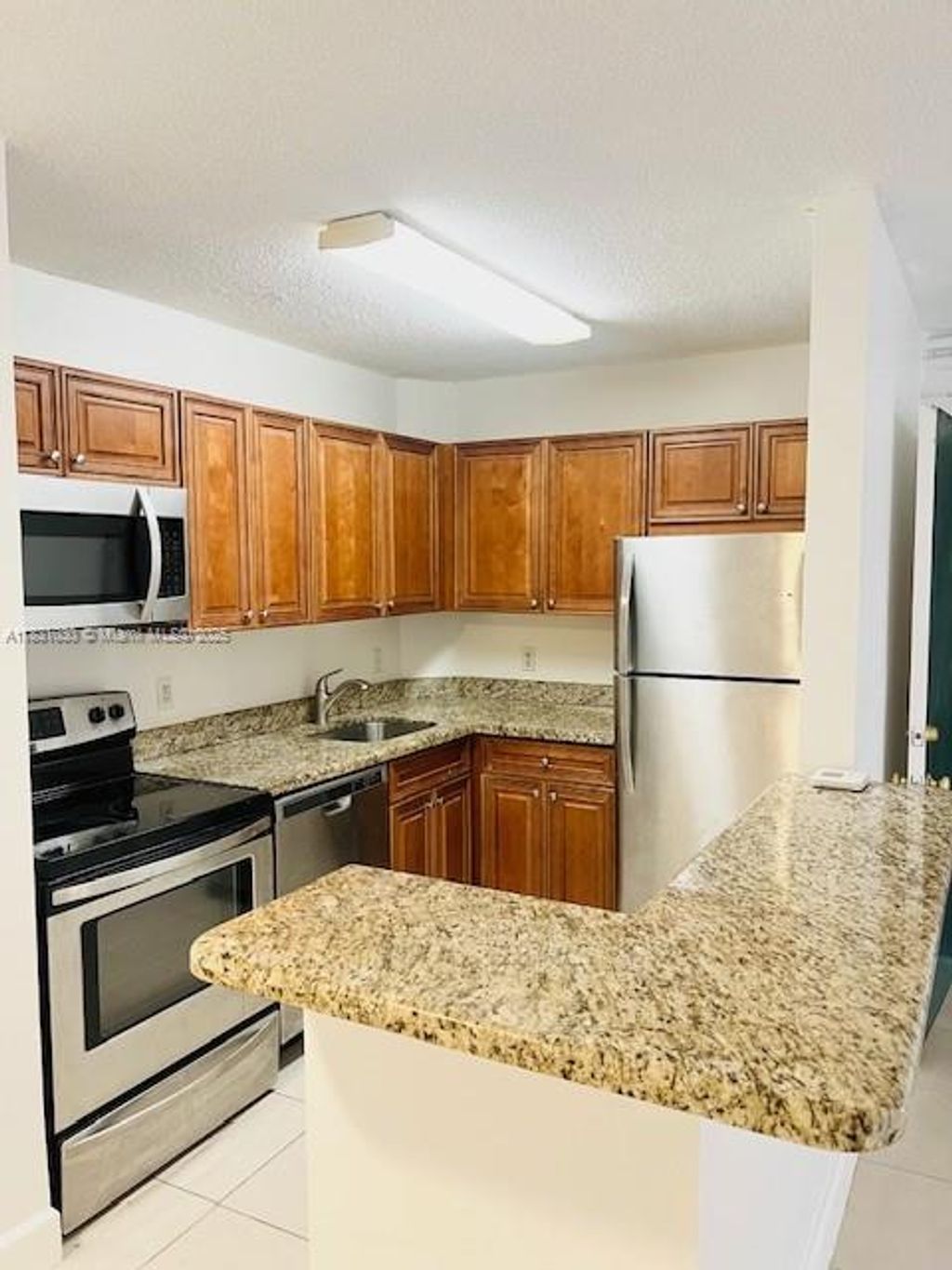 Photo of 10765 Cleary Blvd #103, Plantation, FL 33324 (MLS # A11831030)
