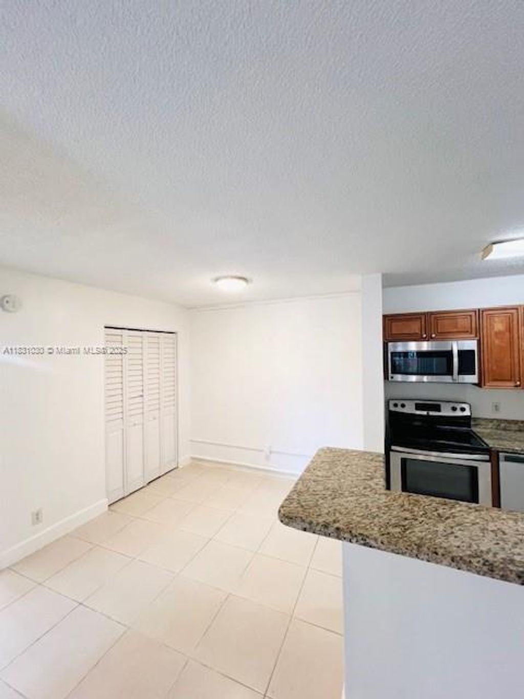 Photo of 10765 Cleary Blvd #103, Plantation, FL 33324 (MLS # A11831030)