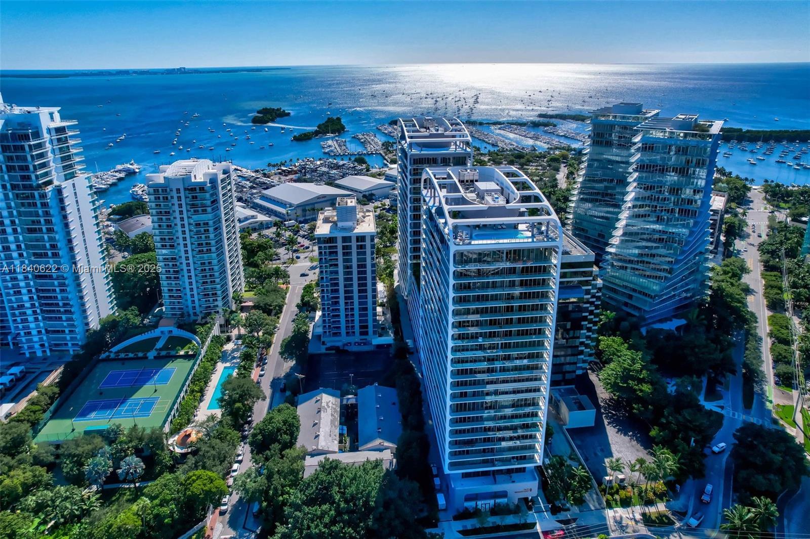 Welcome to Mr. C Residences, an outstanding example of contemporary architecture mingled with European elegance and located in spectacular Coconut Grove. Apartment 1401 is a 4 bedroom, 4.5 bath residence located in the Bayfront Tower with a wrap around terrace offering captivating views of Biscayne Bay as well as spectacular views of the Miami skyline. Details include Italian cabinetry,premium appliances and finishes.Unit features soaring 11 ft ceilings, floor to ceiling windows as well as 2 Primary bedrooms, 3 PARKING SPACES,VALET SPACES AND SEPARATE STORAGE UNIT UNDER A/C. Residents will enjoy 24 hour concierge & butler services, state of the art fitness center,Peloton room, yoga & Pilates room, Playroom, Teen Room, library, business center, media room,2 pools, club and billiard room.