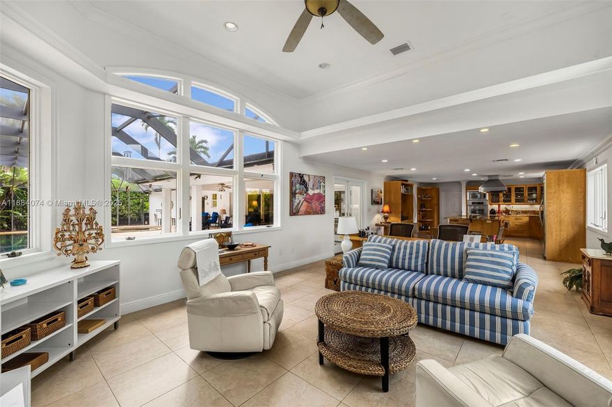 [A Miami Signature Home] Welcome to The Dockside Ranch in Coral Gables—where Florida charm meets timeless elegance. This beautiful home invites you into sunlit spaces accentuated by impact windows that frame picturesque views, enhancing the ambiance created by a cozy dual-sided fireplace and elegant wood floors. The thoughtful design offers a seamless blend of indoor and outdoor living, with a family-friendly layout that includes ample room for both relaxation and entertainment. Step outside to experience an expansive screened pool patio, artfully designed with a spa and waterfall, providing a private oasis for leisurely afternoons. The property offers bay access via a private wood dock, suited for smaller boats due to the low, fixed bridges. A serene and exclusive lifestyle awaits.