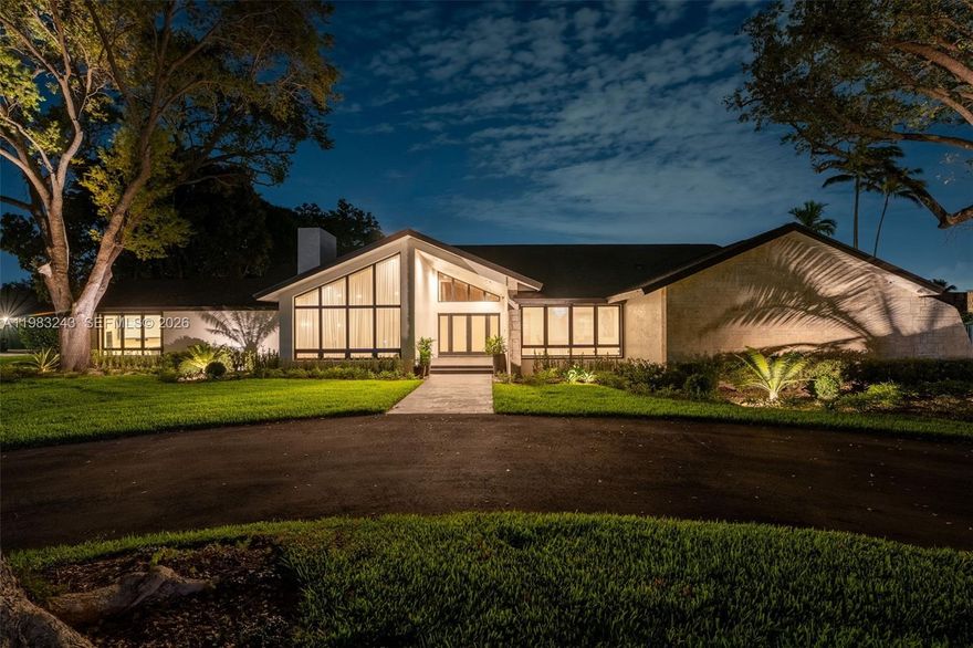 Welcome to Country Grove Estates — a custom residence set on approximately one acre and on a rare double cul-de-sac. This impressive estate features 5 oversized bedrooms, 4bathrooms, and over 4,300 sqft of elegant living space designed for both comfortable family living and grand entertaining. An expansive ±1,500 sq ft covered entertainer’s pavilion anchors the backyard and features a traditional Argentine grill alongside a fully equipped outdoor kitchen with gas grill, gas cooktop, sink, refrigeration, ice machine, and generous prep space. The resort-style pool with Jacuzzi, professionally lighted ~2,400 sq ft full-size basketball court, and lush tropical landscaping transform the property into a private retreat.
Inside, dramatic vaulted wood ceilings and full impact glass fill the home with natural light while providing security and energy efficiency. Spacious living and dining areas flow effortlessly into the home’s main gathering spaces.
The primary suite includes a spa-inspired bathroom with a two-person Jacuzzi set against a dramatic natural rock accent wall with custom ambient lighting and built-in audio.
Additional highlights include a chef’s kitchen with top-of-the-line appliances,breakfast nook, an entertainment room with 122 Inch-HD projector, and smart-home features with app-controlled lighting and whole-home Sonos audio.
A rare opportunity to own a private resort-style estate in one of the area’s most desirable residential settings.