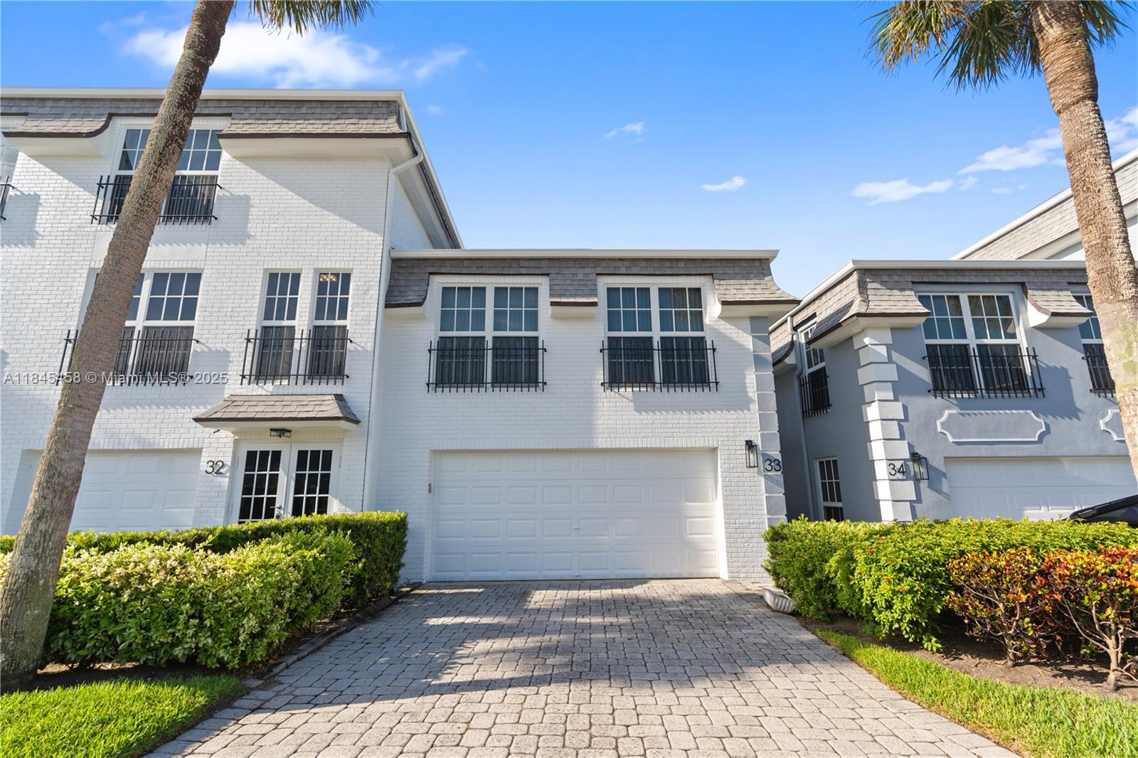 Come see this attractive 3-bedroom, 2.5-bath townhome located in the heart of the prestigious Hillsboro Mile. This two-story townhome features a two-car garage and is just steps away from the Intracoastal and a privately deeded beach. Upon entering, you'll find a spacious, bright, and open floor plan. The kitchen is equipped with solid wood cabinets, granite countertops, and stainless steel appliances. Enjoy the peaceful garden views from your open patio and screened balconies. Experience a resort-style lifestyle with low monthly HOA fees and access to a private pool and hot tub, while being conveniently close to shopping, major highways, entertainment, and top restaurants, as well as Deerfield and Pompano Beach. This property is waiting for your personal touches to make it your home.