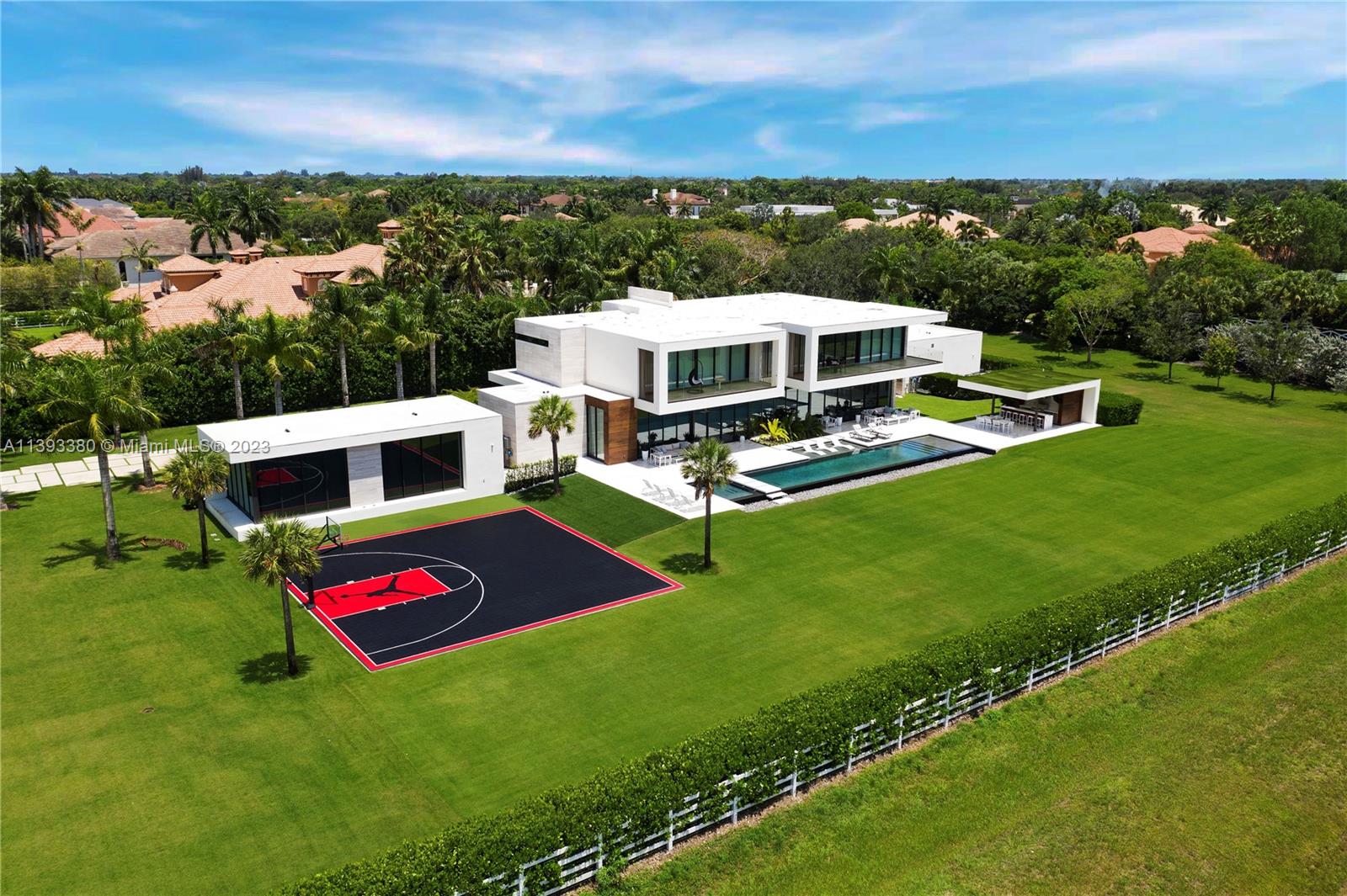 A True Trophy Estate | Designed by acclaimed architects Choeff Levy Fischman, built by renowned Landmark Custom Homes, and nestled within the most exclusive and only gated community in Southwest Ranches, Landmark Ranch Estates. This remarkable 10,300 SF masterpiece offers impressive floor to ceiling glass walls with spectacular views of its expansive yard, resort-sized pool and sunsets. The kitchen is equipped with top-of-the-line Sub Zero, Wolf and Miele appliances, so is the exterior summer kitchen, providing a seamless indoor/outdoor lifestyle experience. The estate has it all; club room, theater, detached gym building, dual laundry rooms, elevator, smart home systems, central vacuum, emergency generator, outdoor pavilion, and much more. Just 25 mins. from FLL Airport. A "MUST SEE"!