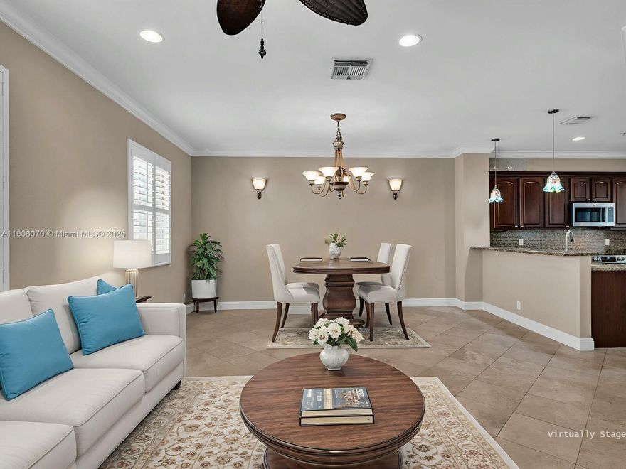 Spacious 3-Bedroom + Office Lakeview Townhome! Welcome to luxury, comfort, and convenience all in one. This beautiful 2-bedroom,open loft, office, 2.5-bath townhome w/2-car garage offers stunning lake views & upscale finishes throughout. It features a Gourmet kitchen with center island, cherry wood cabinets, granite countertops, and newer appliances. Enjoy peaceful lake views from your private balcony — perfect for morning coffee. Elegant marble floors in living areas, hardwood staircase & crown molding throughout. Spacious master suite w/vaulted ceilings, dual closets, and spa-style tub Dedicated office space ideal for working from home. Equipped w/hurricane shutters and a Carrier Infinity A/C system for year-round comfort. Located in a serene and well-maintained community a must see.