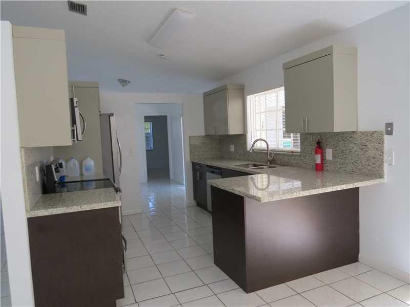 Beautiful home, High Vault Ceilings, 3/2 with family room and one car garage. Just Remodeled inside out, Modern Kitchen, with granite counter tops and Stainless steel appliances, new water heater, new central AC, and hurricane shutters. Tile through out. Close to schools, supermarkets, bus stops and highways hurricane shutters and many more. Won't last!
