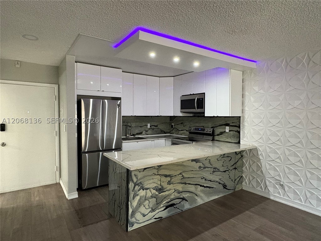 Photo of 1520 Mckinley St #108E, Hollywood, FL 33020 (MLS # A12068136)