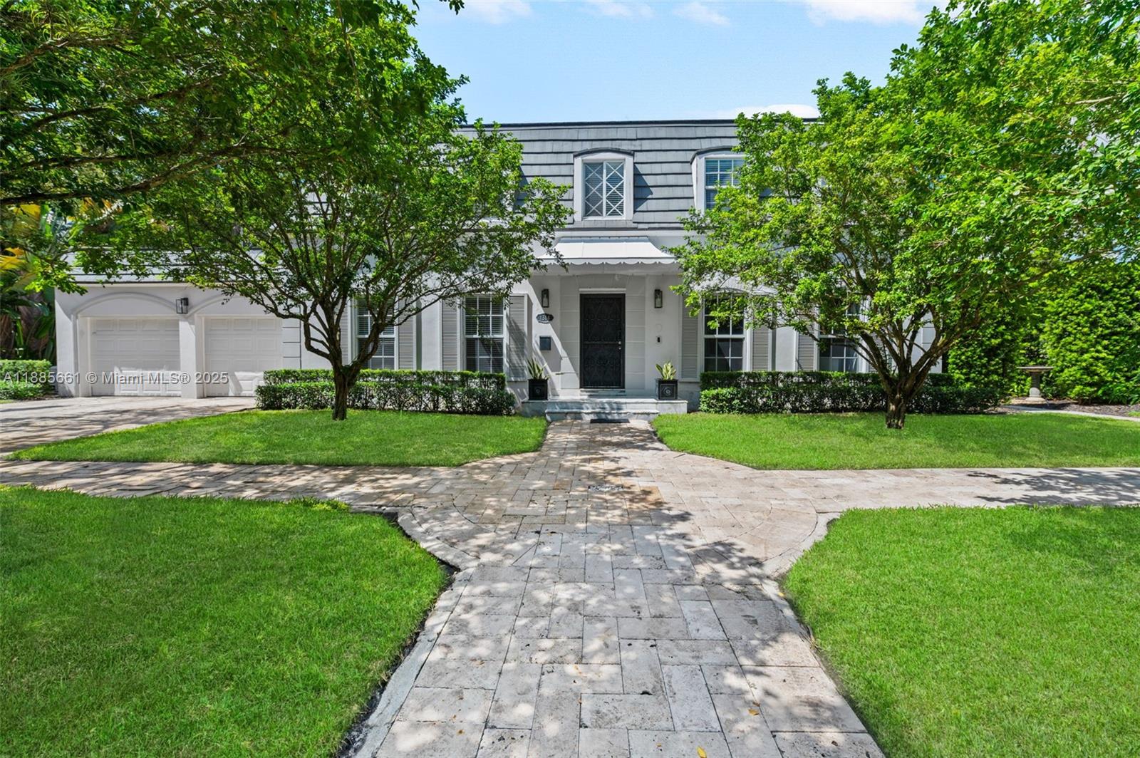 Nestled on an oversized lot along historic Country Club Prado, this French Country–style two-story home blends classic elegance with modern luxury. The gourmet eat-in kitchen with gas cooktop and premium appliances opens to a sunlit Florida room overlooking the covered terrace and sparkling pool. The master suite offers a private dressing room with center island, a spa-like bath with therapeutic tub, and Calacatta gold marble finishes throughout. Thoughtful renovations preserve its historic character while adding contemporary comforts. With nearly 100 feet of tree-lined frontage, double sidewalks, lush foliage, and buried power lines this home offers prestige and presence in one of Coral Gables’ most coveted locations. Square footage per appraiser.