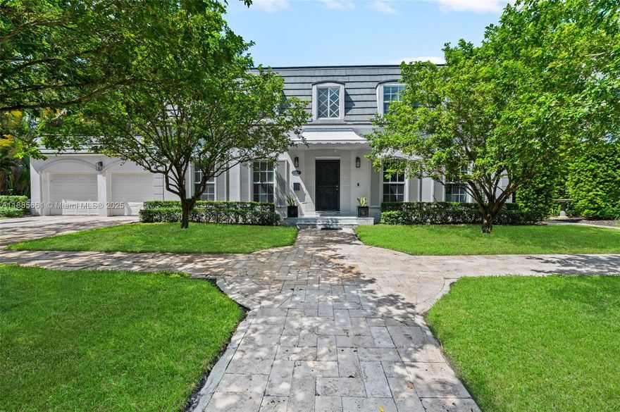 Nestled on an oversized lot along historic Country Club Prado, this French Country–style two-story home blends classic elegance with modern luxury. The gourmet eat-in kitchen with gas cooktop and premium appliances opens to a sunlit Florida room overlooking the covered terrace and sparkling pool. The master suite offers a private dressing room with center island, a spa-like bath with therapeutic tub, and Calacatta gold marble finishes throughout. Thoughtful renovations preserve its historic character while adding contemporary comforts. With nearly 100 feet of tree-lined frontage, double sidewalks, lush foliage, and buried power lines this home offers prestige and presence in one of Coral Gables’ most coveted locations.  Square footage per appraiser.