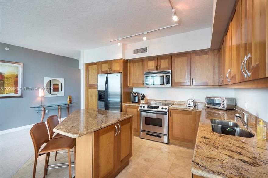 TURN-KEY apt with breathtaking Golf Course, Lake, Ocean & Pool Views from Wrap Around Balcony. Terrific split floor plan & open kitchen are great for entertaining.  Impact windows, granite countertops, SS appliances, plus full size washer/dry. Amenities Galore! 24hr security, valet, business center, theatre room, tennis, spa & fitness center, jogging path, heated pool, billiard & party room. Walk to the beach & restaurants, Gulfstream Park, & drive to Aventura Mall in 10 minutes. EZ to show  Broker Remark