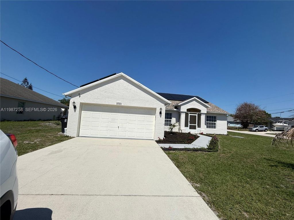 Photo of 1001 SW Estaugh Ave, Port St Lucie, FL 34953 (MLS # A11987258)