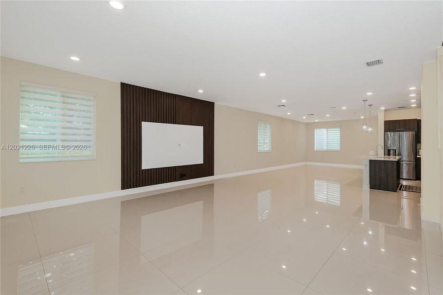 Modern corner townhouse with private NEXT-GEN studio in highly sought-after Landmark at Doral. This spacious 2-story, loft-style residence offers 4 bedrooms and 3.5 bathrooms in total, including a fully equipped private studio with its own entrance, kitchen, bathroom, laundry, and dedicated side parking—perfect for in-laws, guests, a home office, or can be rental income and can rent as much as 1800 per month. Perfect for investors
Flooded with natural light from its premium corner lot, the home features an open modern layout, oversized porcelain tile floors, wood stairs, high-impact windows and doors, and a sleek kitchen with stainless steel appliances, wall oven, and quartz countertops. The generous primary suite includes a huge walk-in closet, and the 2-car garage provides plenty of storage and convenience.
Residents enjoy a true resort-style lifestyle with an impressive clubhouse offering a sparkling pool and kids’ splash park, tennis courts, fitness center, spa/sauna, game and social rooms, open-air amphitheater, and multiple parks and BBQ areas. Ideally located near A-rated schools, including the renowned Doral International Math and Science Academy, this home is just minutes from Miami International Airport, major highways, top shopping centers, supermarkets, hospitals, and the vibrant dining and entertainment of Downtown Doral.