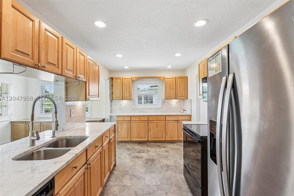 Photo of 8855 NW 10th Pl, Plantation, FL 33322 (MLS # A12047938)
