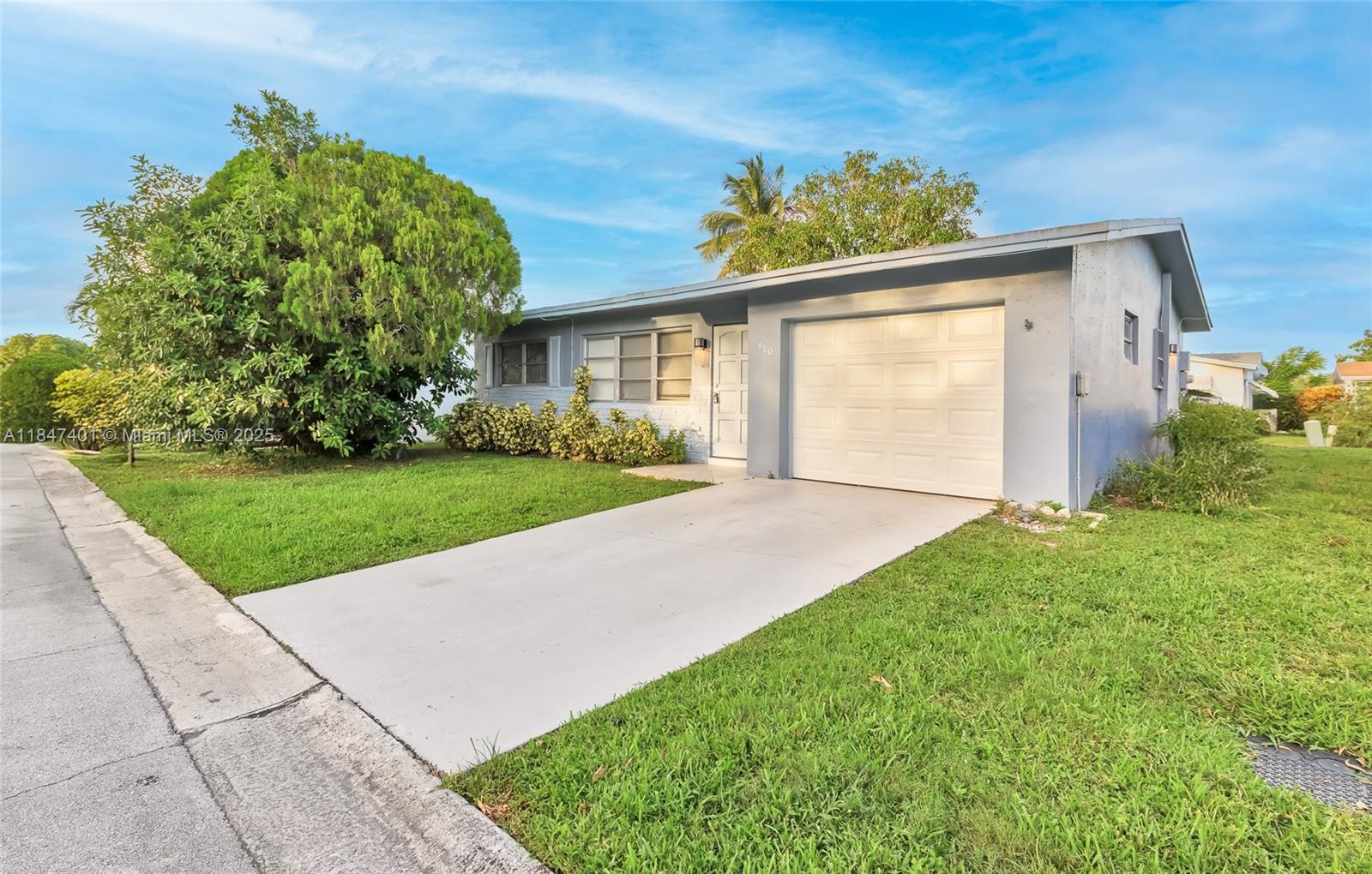 recently remodeled two-bedroom, one-bath home located at 980 Northwest 69th Avenue, Margate, Florida. This home features brand new flooring throughout, a new kitchen with granite countertops, and an upgraded bathroom with new floor tiles. It also includes a nice patio area outside and a one-car garage