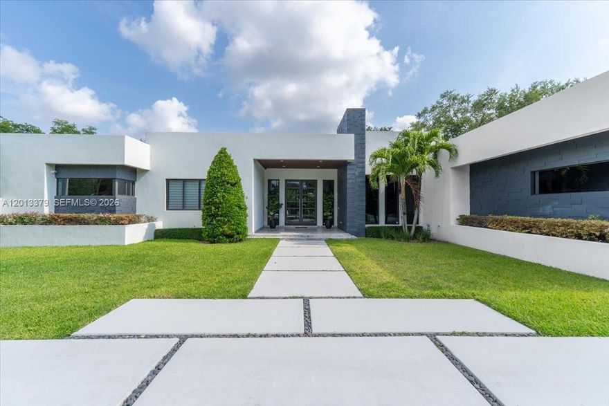 Exquisite modern estate completed in 2021, ideally positioned on a prime corner lot in the prestigious enclave of North Pinecrest. This sophisticated, newer construction, showcases impeccable design and exceptional scale, offering six bedrooms and eight Bathrooms, complemented by a gourmet kitchen featuring high-end appliances. Expansive, light filled living spaces flow seamlessly with extended room proportions, completed by oversized bedrooms and custom closets that surpass typical expectations in the area. 
The residence delivers both grandeur and functionality.  Step outside to a true resort-style oasis featuring a stunning pool, fully equipped outdoor kitchen, beautiful outdoor shower, and a dedicated outdoor bathroom-enhanced by a premium indoor and outdoor surround system for the ultimate entertainment experience.  Designed for effortless entertaining and elevated indoor outdoor living.
The coveted corner setting enhances privacy, further elevated by lush, mature landscaping and a fully installed security and alarm system, creating a serene and private retreat.  A true turnkey masterpiece combining modern architecture, superior, craftsmanship, and timeless luxury in one of pinecrest most desirable neighborhoods.