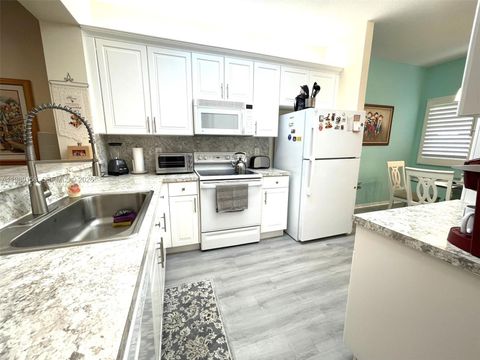 Photo of 7775 Yardley Dr #409, Tamarac, FL 33321 (MLS # A11980158)