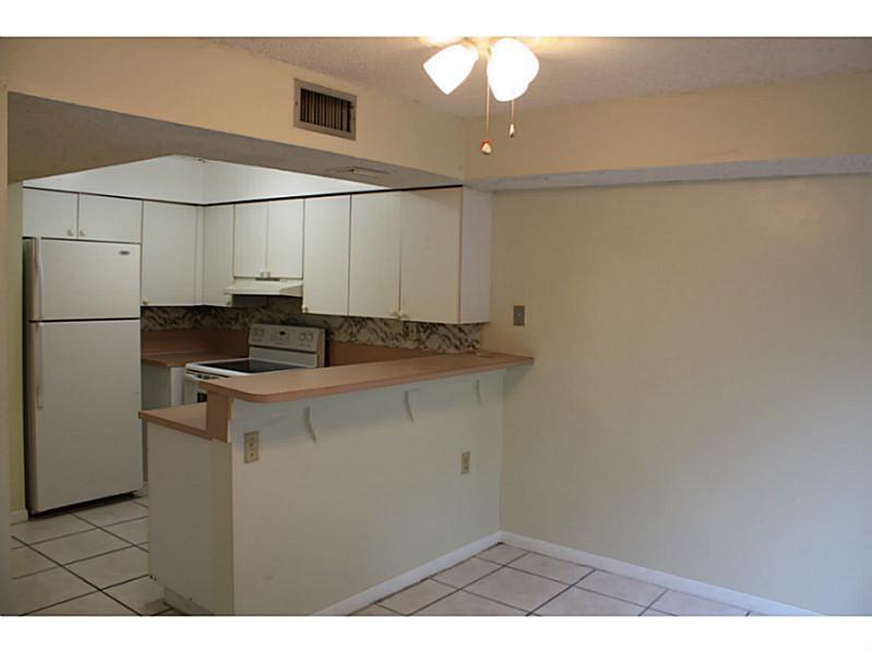 Why rent 4 walls when you can rent a 2-story townhome with 2 patios for the same price! Front fenced courtyard, separate storage room & fenced backyard + 1 assigned parking space in front of your property & guest parking spaces all around. 2 bedrooms + 2 bathrooms upstairs, 1/2 bathroom downstairs. All tiled living areas with new carpet on the stairs. Full sized washer and dryer. Vacant and ready to go. Walk stroll or roll to Walmart, Home Depot, restaurants & more. Background checks performed.