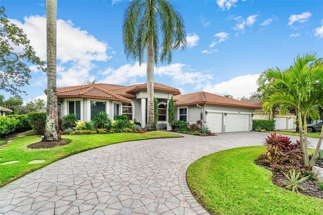 Don't miss this incredible opportunity to own a beautifully updated 5-bedroom, 3-full bath waterfront home in the desirable "Isles" of Coral Springs, an upscale gated community just minutes from major highways. The large chef's kitchen boasts stainless steel appliances, an island with granite countertops, and ample space for culinary creations. The expansive master suite offers a cozy sitting area, two walk-in closets, and a luxurious master bath complete with a jetted spa tub, walk-in shower, and private water closet. Additional features wood floors, volume ceilings, formal living & dining room, office with built-in cabinetry, a screened-in heated, saltwater pool with 2 Jacuzzis and waterfall, three-car garage, impact windows and doors, and a location within an A-rated school zone.