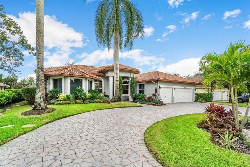 Don't miss this incredible opportunity to own a beautifully updated 5-bedroom, 3-full bath waterfront home in the desirable "Isles" of Coral Springs, an upscale gated community just minutes from major highways. The large chef's kitchen boasts stainless steel appliances, an island with granite countertops, and ample space for culinary creations. The expansive master suite offers a cozy sitting area, two walk-in closets, and a luxurious master bath complete with a jetted spa tub, walk-in shower, and private water closet.  Additional features wood floors, volume ceilings, formal living & dining room, office with built-in cabinetry, a screened-in heated, saltwater pool with 2 Jacuzzis and waterfall, three-car garage, impact windows and doors, and a location within an A-rated school zone.