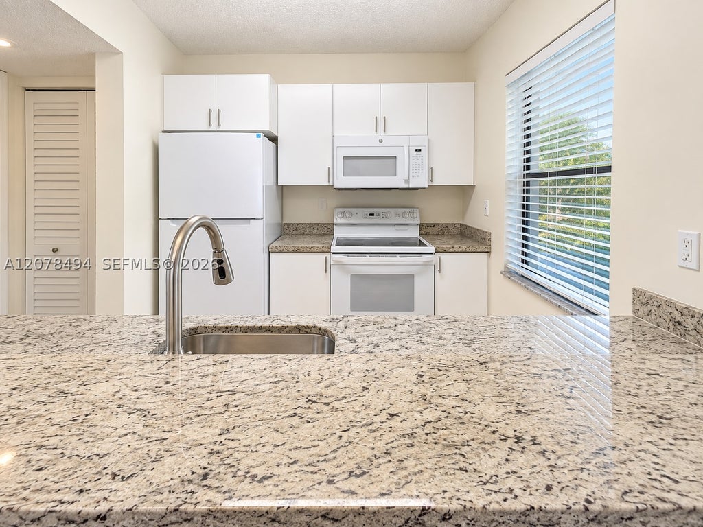 Photo of 3396 Foxcroft Rd #316, Miramar, FL 33025 (MLS # A12078494)