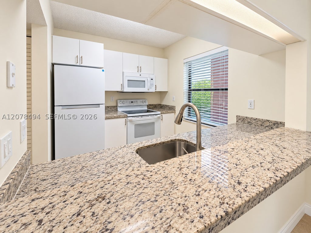 Photo of 3396 Foxcroft Rd #316, Miramar, FL 33025 (MLS # A12078494)
