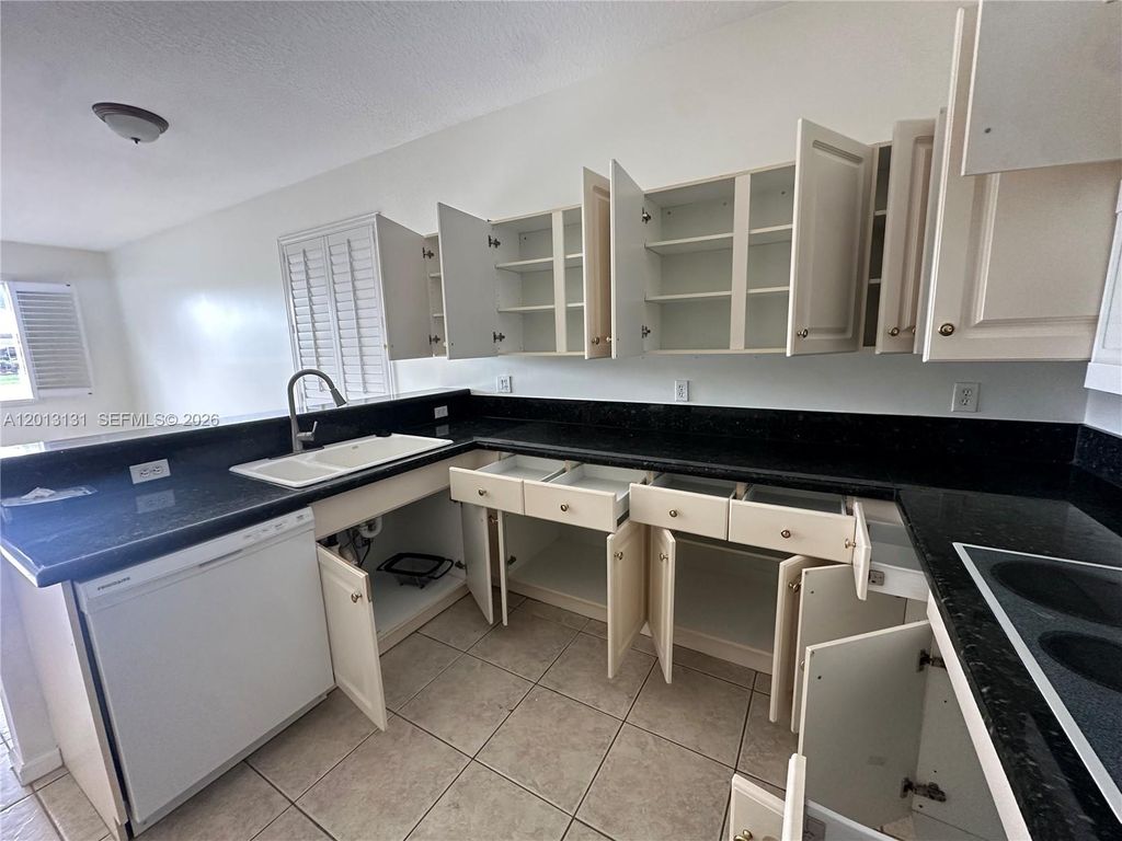 Photo of 117 Palm Cir, Atlantis, FL 33462 (MLS # A12013131)