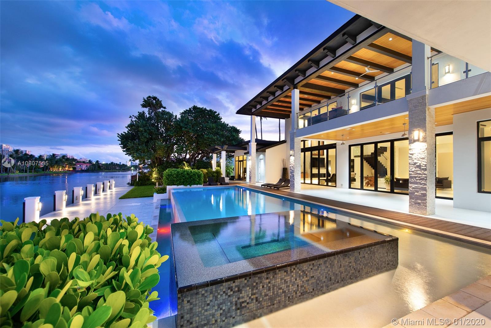 New Built Waterfront Estate in Hollywood to the highest construction standards. Privately gated , the approach to the home is grand,lush landscaping with a spacious deck,boat lift , Infinity pool, spillover spa and fire pit provide year -round entertainment. With 150 feet of dockable frontage on a 120 ft deep canal. This property boosts access to the Atlantic ocean.A smart home with a elegant interior features touches from stone accents to glass stairs and private elevator .Gourmet kitchen, expansive master bedroom with split master bath. This property features 5 large bedrooms with 5 bathrooms and a half. Hollywood Golf Estates is a cozy enclave of contemporary homes epitomizing the South Florida lifestyle .
