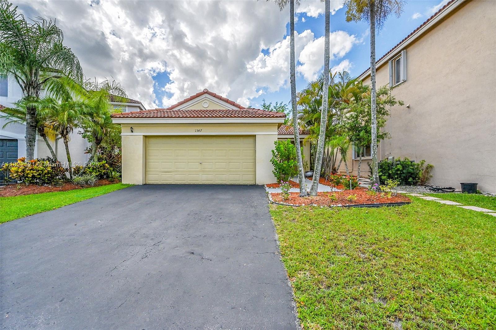 Imagine coming home to soaring vaulted ceilings, sunlight streaming across warm laminate floors, and a spacious kitchen perfect for family dinners or weekend brunch. Every detail has been thoughtfully updated, new lighting, blinds, smooth ceilings, and modern fixtures throughout. Step outside to your landscaped backyard and screened lanai, ideal for morning coffee or evening gatherings. Nestled in Weston’s gated Savanna community, you’ll enjoy resort-style amenities and A+ schools, all with no HOA approval required. This is more than a house. It’s the next chapter of your life. Come see it before someone else writes their story here.