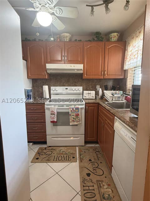 Photo of 9001 Sunrise Lakes Blvd #201, Sunrise, FL 33322 (MLS # A12065243)