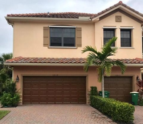 Photo of 5919 NW 56th Pl, Tamarac, FL 33319 (MLS # A12020994)