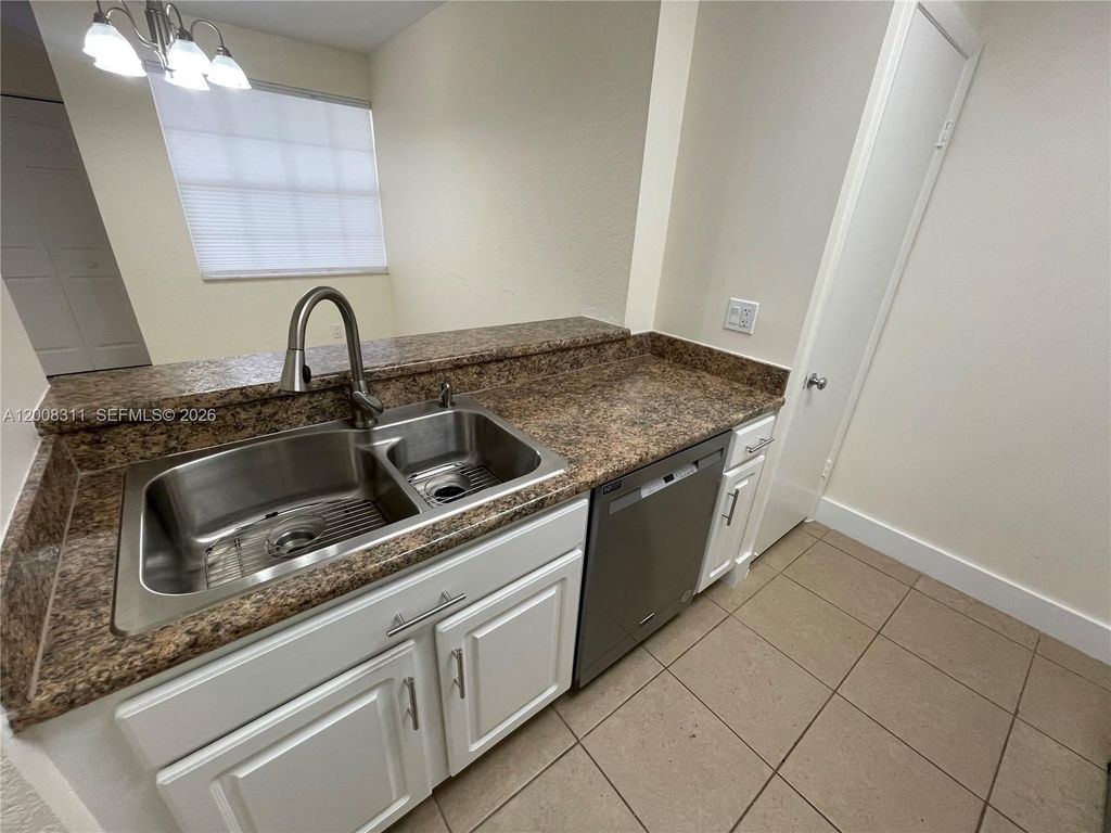 Photo of 2811 N Oakland Forest Dr #102, Oakland Park, FL 33309 (MLS # A12008311)