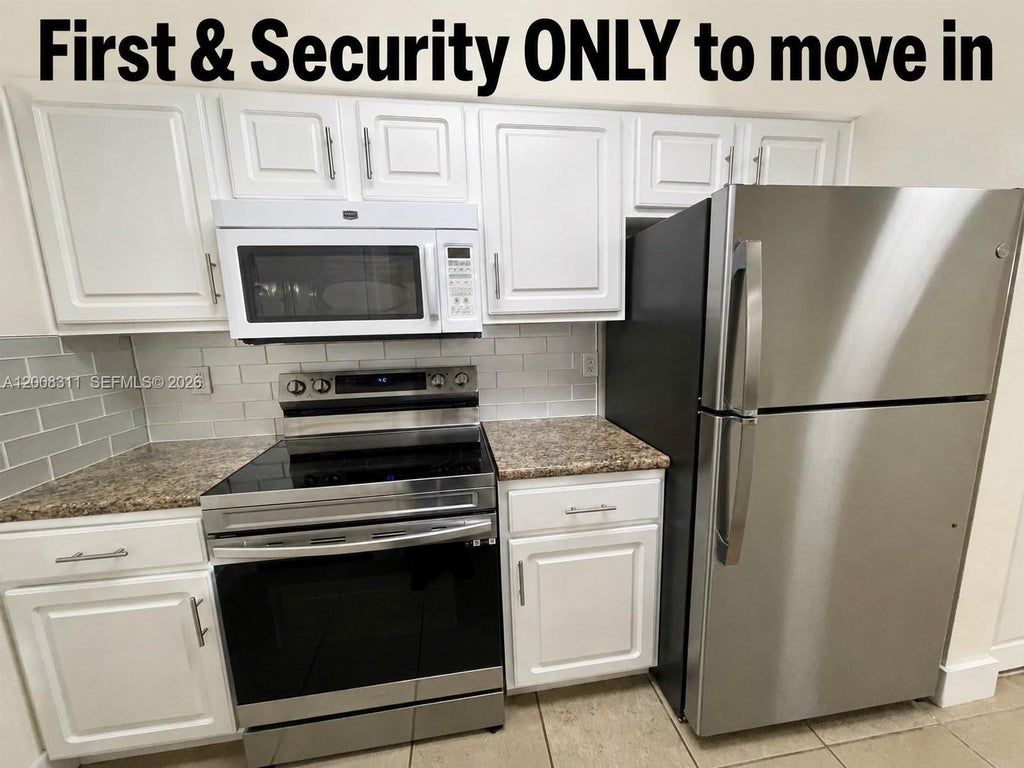 Photo of 2811 N Oakland Forest Dr #102, Oakland Park, FL 33309 (MLS # A12008311)