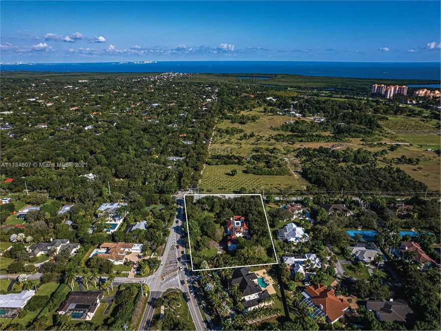 Expansive 2.4 acre corner lot that HAS POTENTIAL TO BE SUBDIVIDED. This unique gated estate features 8,252SF liv w/ 9 BED/9.5 BTH, new roof with solar panels and more. 1st floor features family room w/ bar & full underground wine cellar for quality entertainment. Take elevator or stairs to 2nd floor, offering 6 BEDs w/ updated Italian porcelain floors. Backyard boasts 2 BBQs & heated saltwater pool. House features 2 addtnl guest suites, 3 car garages, generator, 4 fireplaces, new roof & 24H security cameras throughout. Front doors open to grand foyer w/ 30FT ceilings,1st floor offers marble flooring throughout formal living & dining rooms + office & updated kitchen w/ subzero appliances. Conveniently located next to Miami's best private schools.