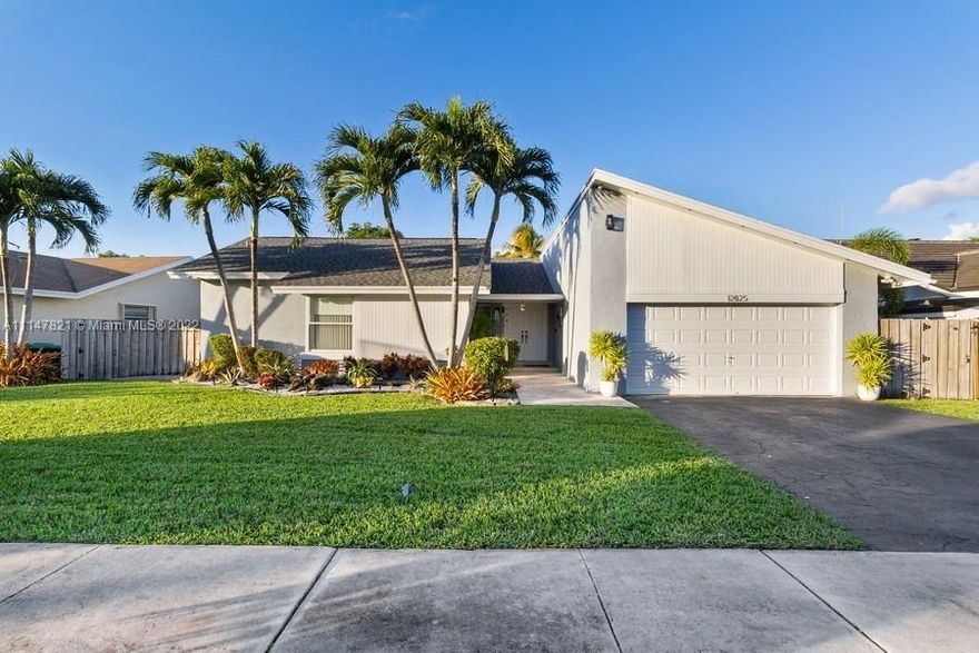 This Is A WOW!. Spotless 3 Bedroom 2.5 Baths PLUS Study/Den/Office . Upgrades Galore. Paved Entry, Impact Windows and Doors with Additional Hurricane Shutters, Custom Lighting on Volume Ceilings, 8 Exterior Security Cameras + Ring Alarm, Laminate Floors Throughout, Digital Temperature Control System, Digital Orbit Irrigation System, Newer Carrier A/C 2.5 yrs, Shingle Roof 1.5 Yrs, Open Covered  Patio With Fans, Custom Lighting and TV Connection. Updated Baths, Superb Landscaping in Front and Back Yard with Fruit Trees in The Garden Area .Wood Privacy Fenced Yard.
Owner Willing To Sell Some Furniture Separately..***Interior Surveillance Cameras On Premises (Not Included in Sale).***Gonna Love It!........."Multiple Offer Situation"