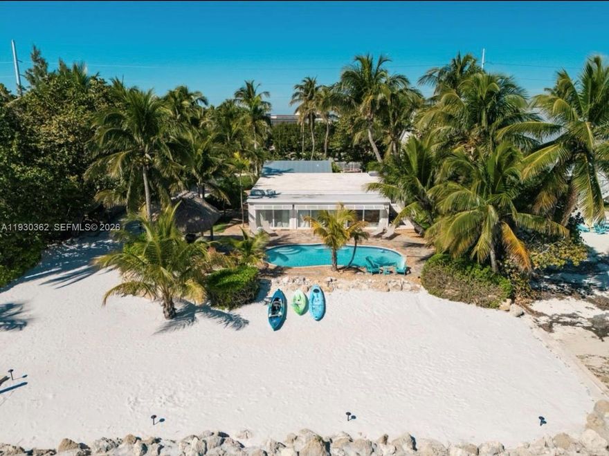 Sandy Beach Cove - A Luxurious Island Retreat

Nestled in the heart of Islamorada, Sandy Beach Cove is a stunning luxury property that offers a private slice of paradise. This unique estate features not just one, but two beautiful dwellings: a spacious main house and a charming, cozy cottage, perfect for guests or extended family.
100’ of Ocean Front Private Beach ,23,350 square feet of Prime land and 20,000 sqf of submerged land this property offers ample space for RV parking trailers, and more. Enjoy your own private beach and Your own Private Boat Ramp for launching and hauling jetskis,skiffs,or pontoons right into your crystal-clear waters. The entire estate has a resort-like feel, making it a true island oasis.
Owner Financing available.